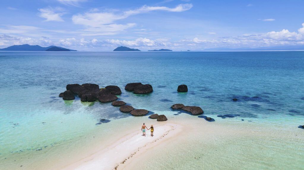 Couple man and women on a tropical island in Thailand, Koh Kham Island Trat Koh Mak