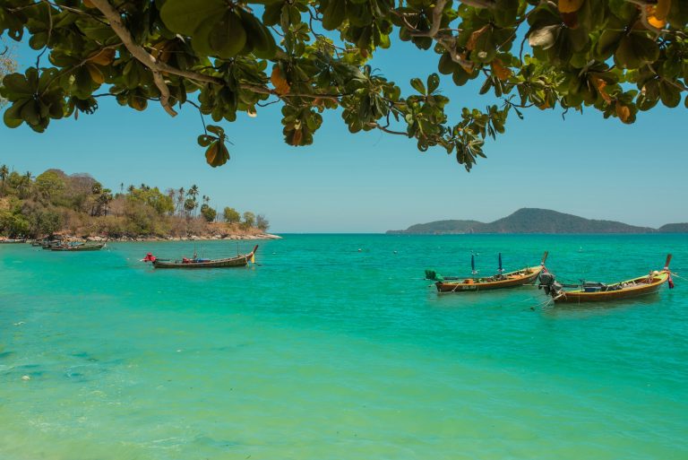 Fishing boats on the coast of the sea in Thailand on the island of Phuket